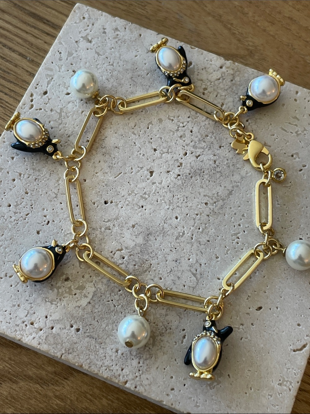 kate spade Gold-tone Pearl & Black Penguin Charm Bracelet